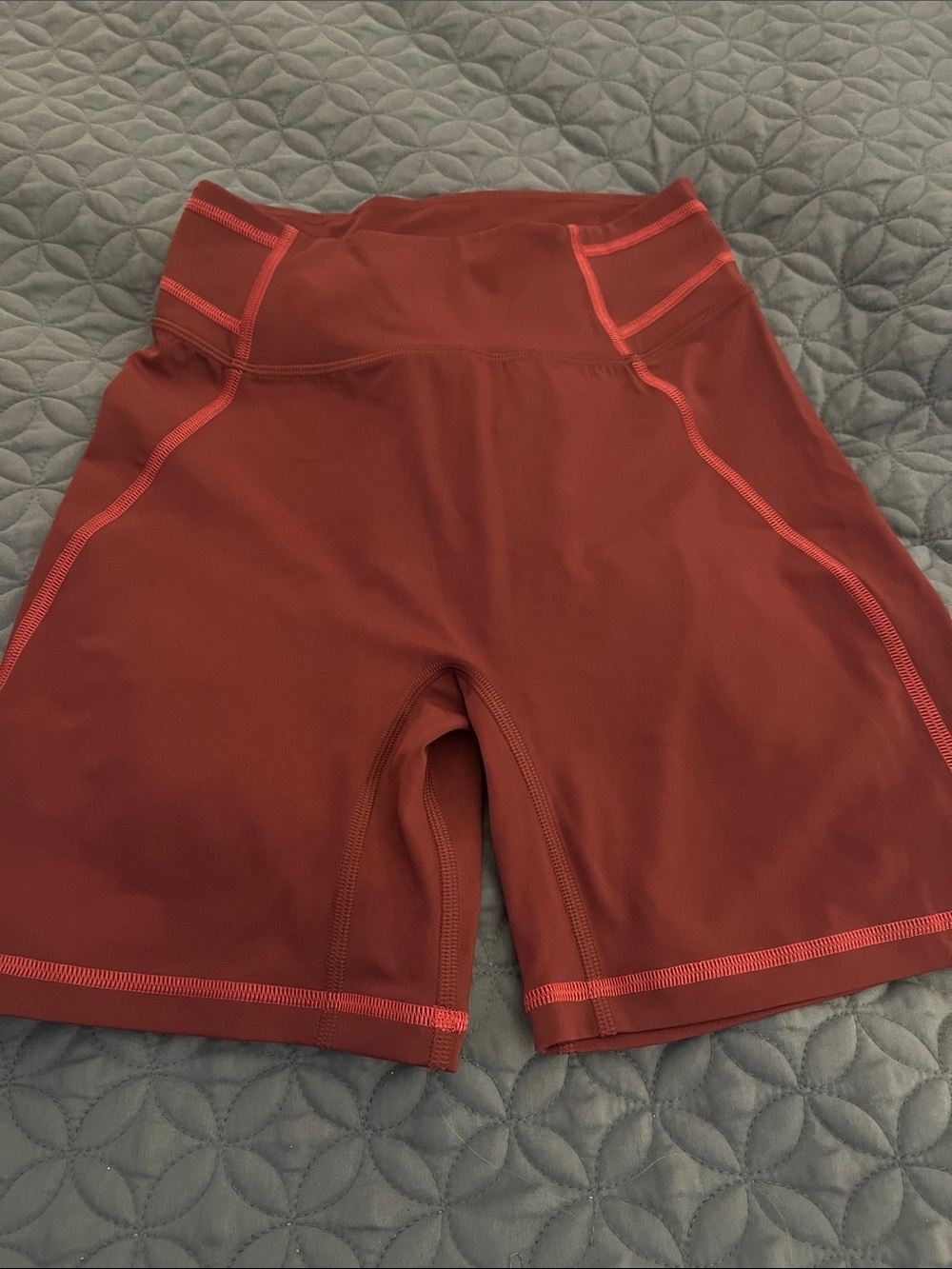 Gymshark High-Rise Rust Bike Shorts with Coral Stitching